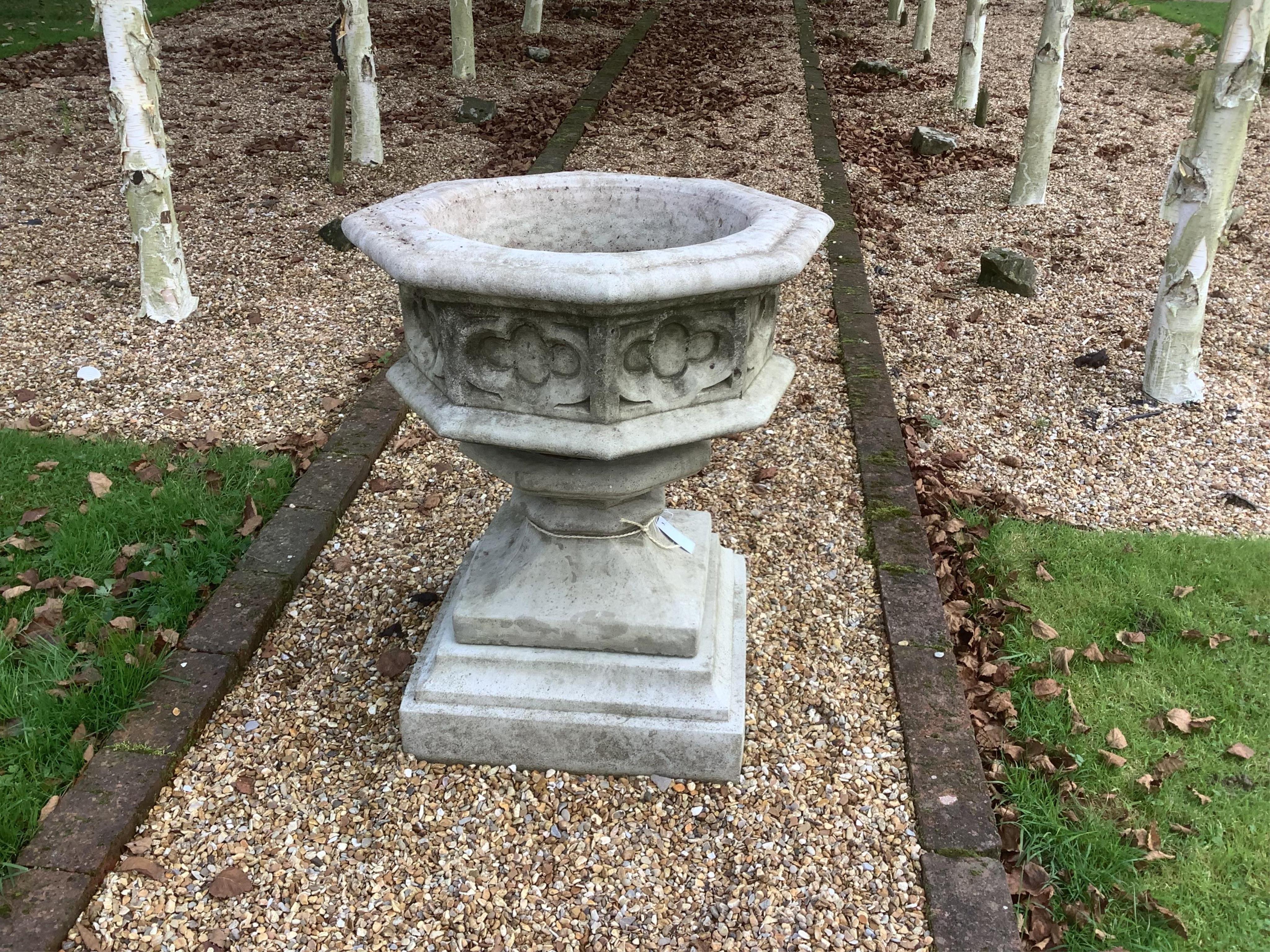 A reconstituted stone font planter, height 72cm, width 62cm. planting removed. Condition - weathered, otherwise good